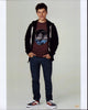 Nolan Gould photo print in jeans and sweatshirt with hands in pockets.