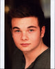 Noah Matthews headshot photo print featuring a vibrant green top.