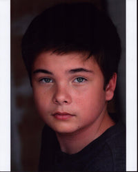 Noah Matthews headshot photo print in gray top