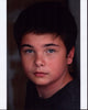 Noah Matthews headshot photo print in gray top