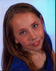 Alyssa Cross headshot photo print in blue shirt, available in multiple sizes.