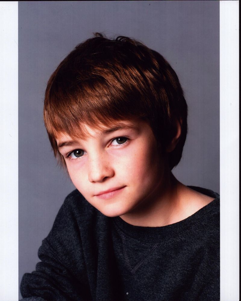 Cj Adams headshot photo print in gray top, available in multiple sizes.