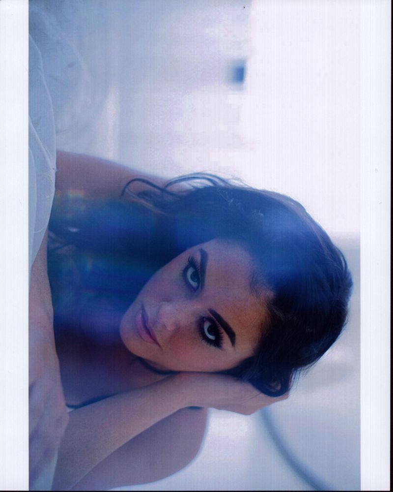 Jenna Chapple Laying On Bed Photo Print showcasing serene beauty.