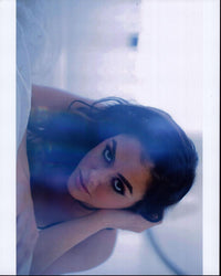 Jenna Chapple Laying On Bed Photo Print showcasing serene beauty.