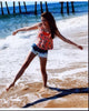 Mckaley Miller Playing In Waves Photo Print showcasing a playful moment by the waves.