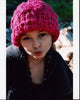 Caitlin Carmichael photo print wearing a pink knit hat.