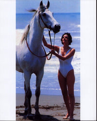 Tahnee Welch on the beach with a horse photo print.