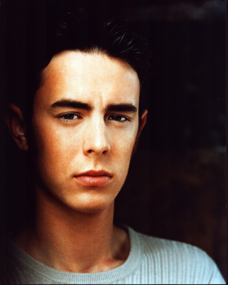 Colin Hanks headshot photo print in tan sweater.