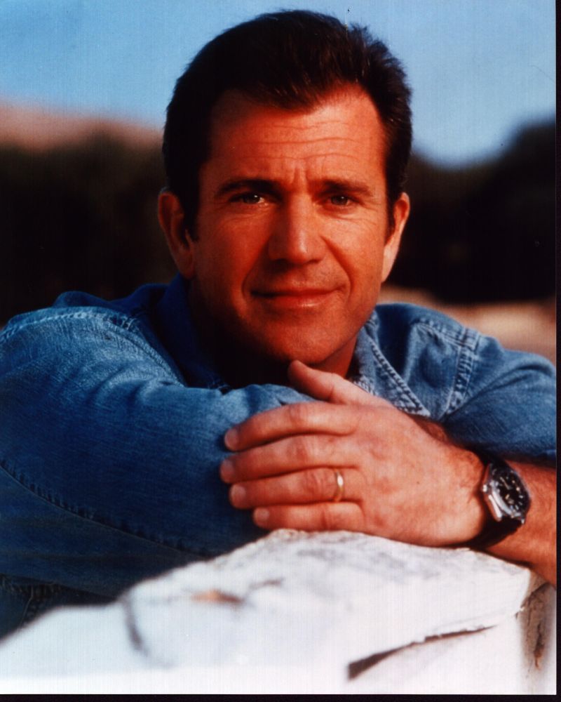 Mel Gibson leaning on rocks photo print in denim shirt