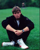 C. Thomas Howell Sitting in Grass Photo Print - Multiple Sizes