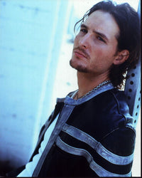 Peter Facinelli leaning on post in a leather jacket photo print