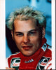 Close-up photo print of Jacques Villeneuve in racing uniform.