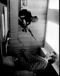 Black and white photo print of John Larch with gun and Clint Eastwood in Dirty Harry movie scene.