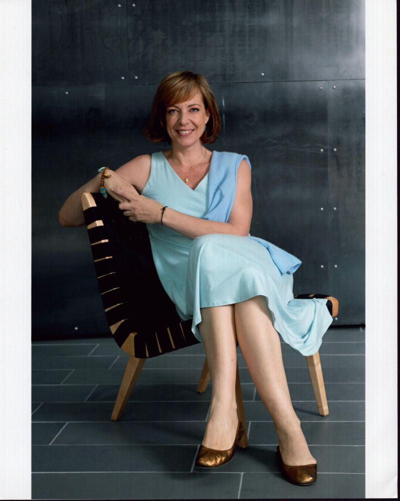 Allison Janney wearing a blue dress sitting in a chair photo print