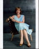 Allison Janney wearing a blue dress sitting in a chair photo print