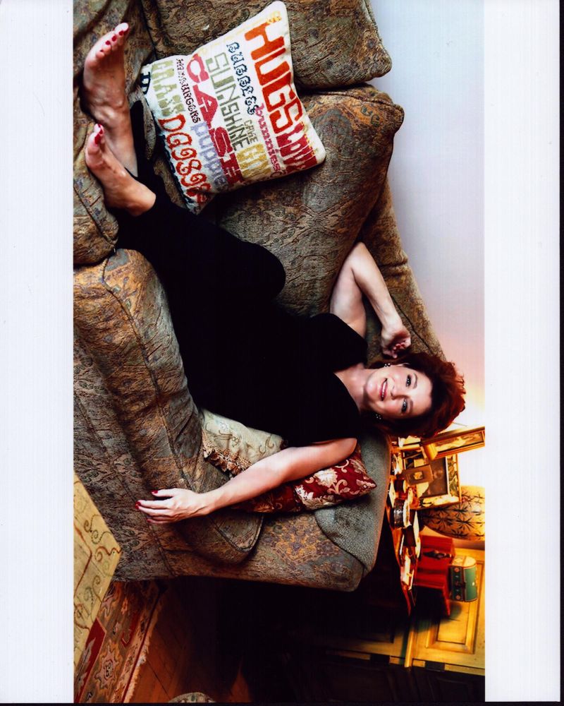 Kate Mulgrew sitting on couch photo print, elegant decor for fans.