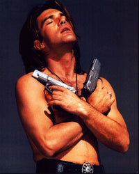 Antonio Banderas shirtless holding two guns in a scene from Desperado photo print.