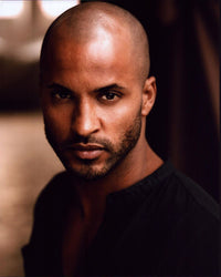 Ricky Whittle headshot photo print in black top, available in multiple sizes.