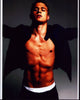 Charlie Hunnam shirtless photo print with jacket, arms outstretched.