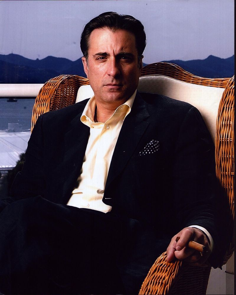 Andy Garcia Sitting in Suit with Cigar Photo Print