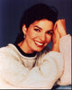 Sela Ward in tan sweater photo print showcasing elegance and style.