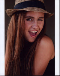 Kendyl Lynch Winking in Hat Photo Print showcasing playful charm.