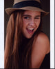 Kendyl Lynch Winking in Hat Photo Print showcasing playful charm.