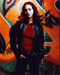 Jessica Alba photo print in leather jacket in front of graffiti wall