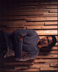 Rick Fox leaning against a wall with arms crossed photo print.