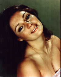 Jennifer O'Neill elegant headshot photo print in strapless top.