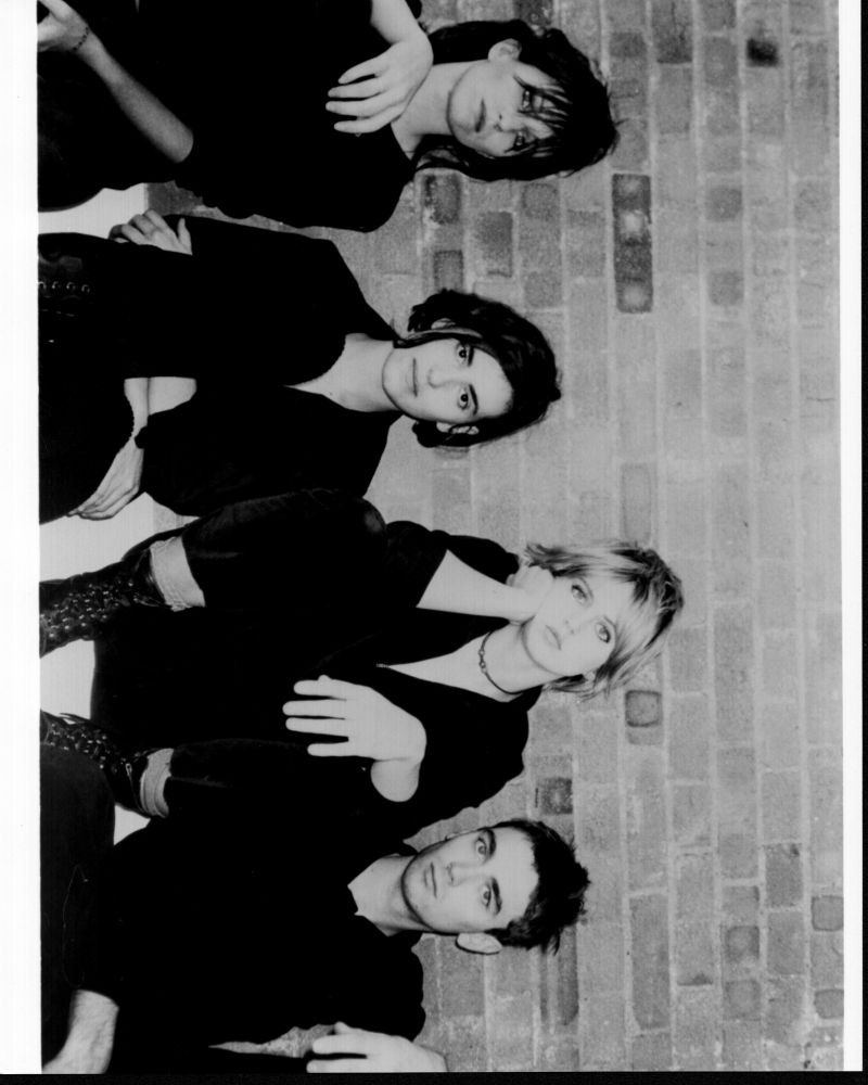 Elastica black and white photo print in front of a brick wall
