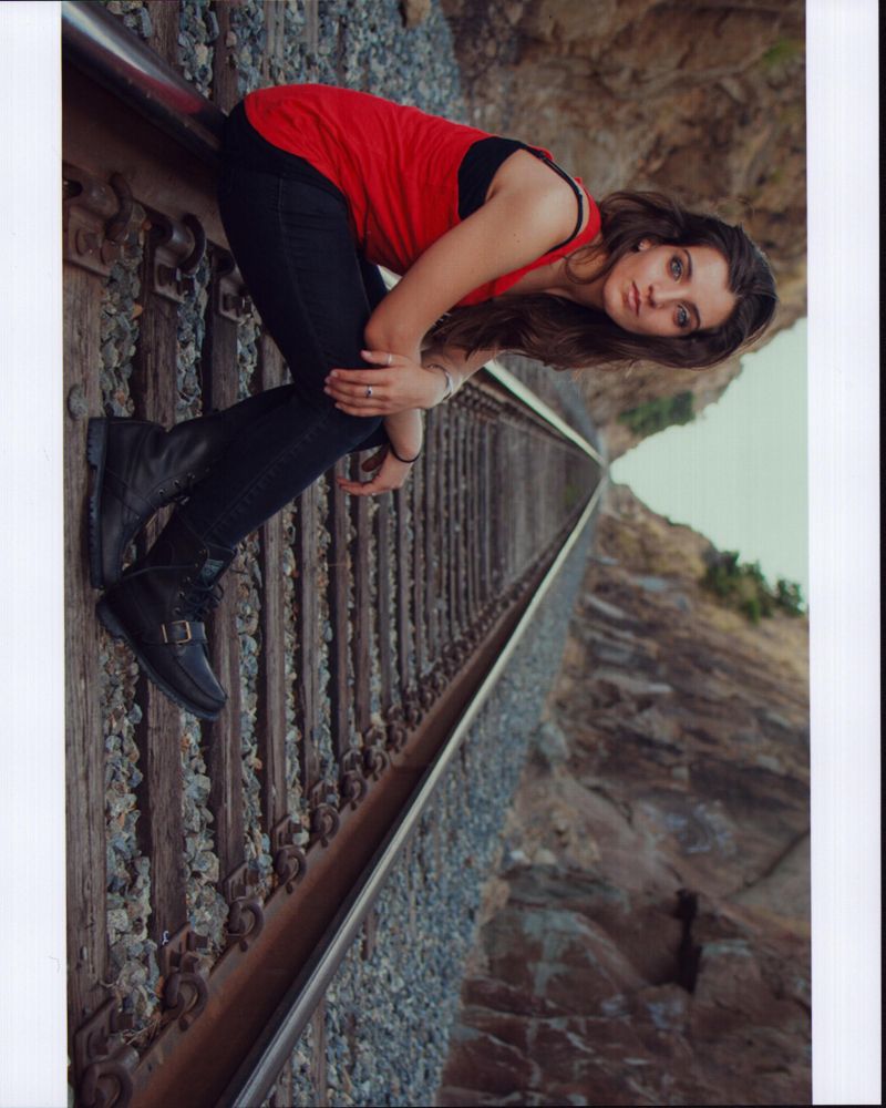 Bianca Mihailov Sitting on Railroad Tracks Photo Print