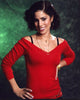 Ana Ortiz photo print in red top with gold necklaces