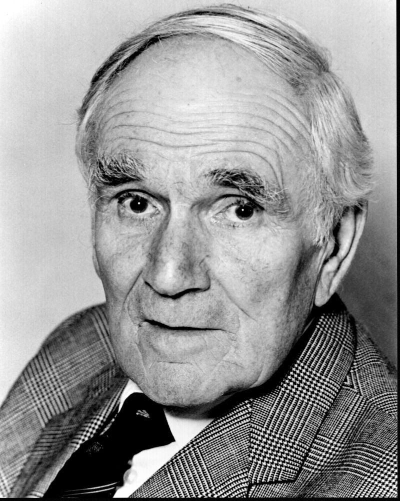 Desmond Llewelyn black and white photo print in suit and tie.