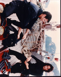 Pierce Brosnan and Michelle Yeoh on a boat from Tomorrow Never Dies photo print.