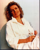 Susan Sullivan in white robe holding a mug photo print.