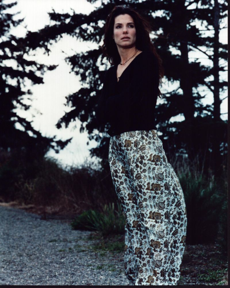 Sandra Bullock in Practical Magic wearing a sweater and floral skirt - photo print.