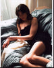 Michelle Monaghan laying on couch photo print, perfect for home decor.