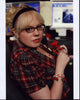 Kirsten Vangsness as Penelope Garcia in plaid shirt at desk photo print.