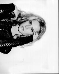 Black and white photo print of Juliette Jackson in ripped sweater.