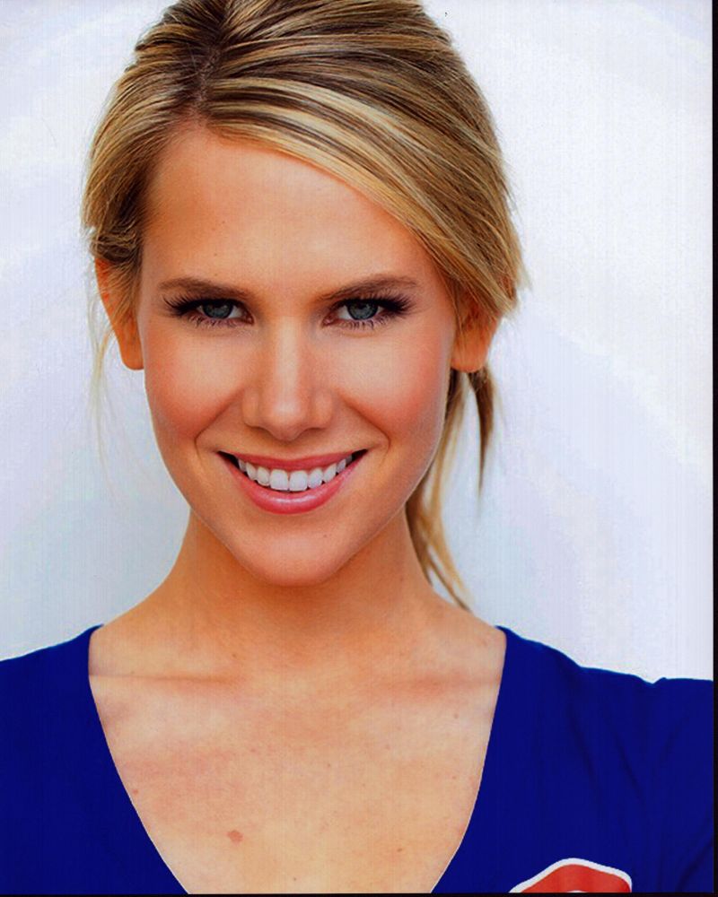 Juliette Jackson headshot photo print in blue top, capturing elegance.