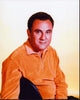 Bill Dana sitting in an orange sweater photo print