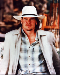 Val Kilmer wearing a white hat and tan jacket photo print