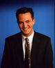 Matthew Perry smiling in a suit and tie photo print
