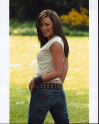 Natasha Hamilton photo print in jeans looking over shoulder.