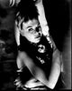 Black and white photo print of Susannah York laying with doll in The Killing of Sister George.