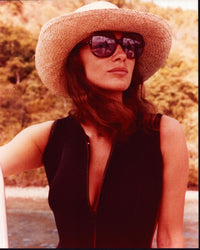 Jacqueline Bisset wearing a straw hat and sunglasses photo print