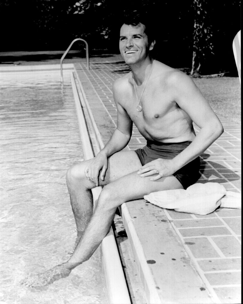Fernando Lamas Black and White Photo Print sitting poolside.