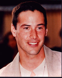 Close-up photo print of Keanu Reeves in a tan suit.