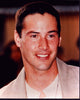 Close-up photo print of Keanu Reeves in a tan suit.